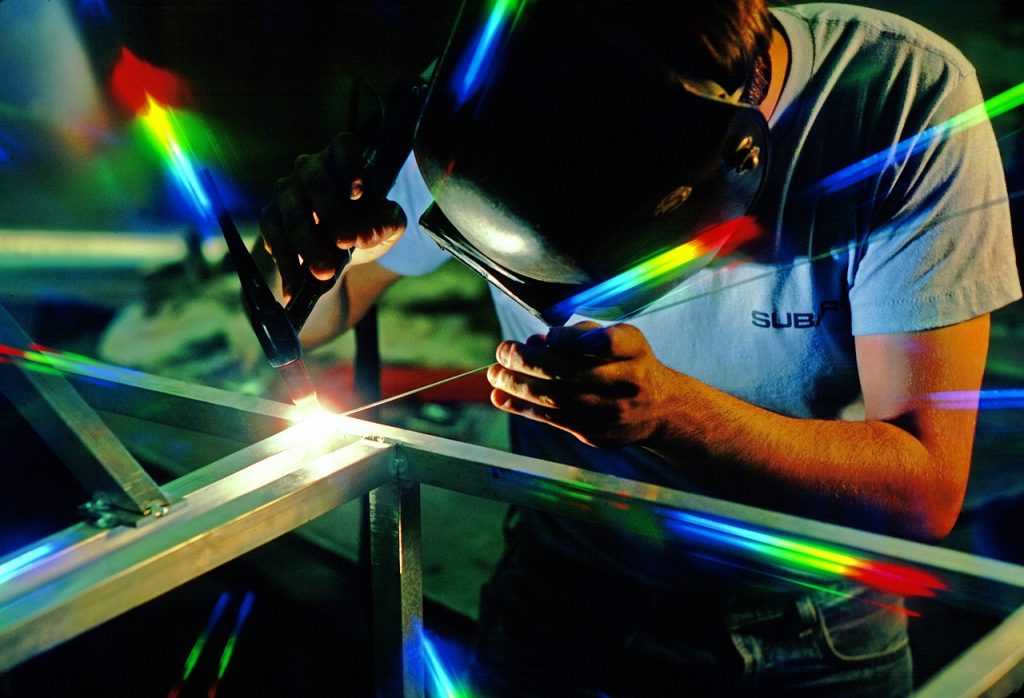 Closeup of a manufacturing worker.  Manufacturing offers many people a good-paying job without a traditional degree. 