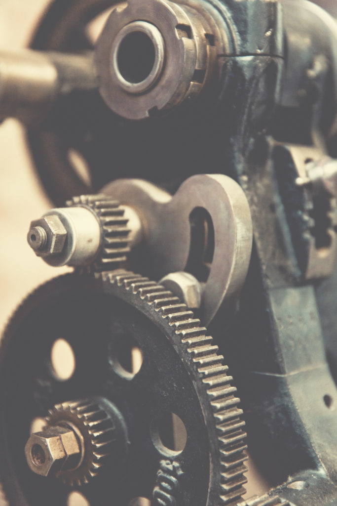 close up of a toothed gear system.  Such systems may be affected by equipment obsolescence. 