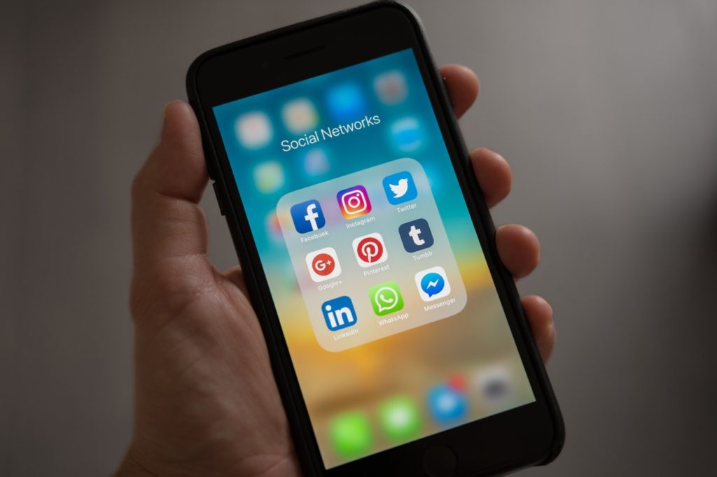 Phone showing social networks that use machine learning algorithms