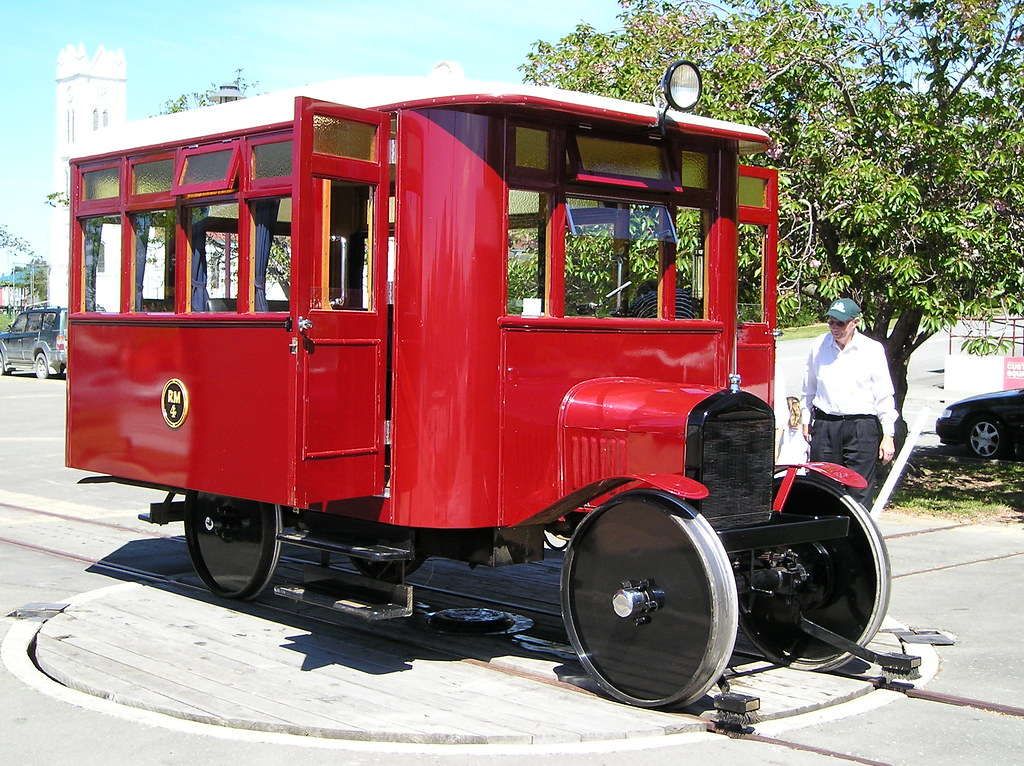 A man looks at a Ford Model T Rail Car.  21st Century manufacturing expands 20th century ideas. 