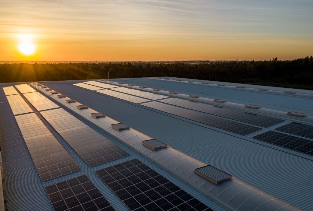 Closeup of solar panels on a manufacturing plant roof.  This is one example of sustainable manufacturing practices. 