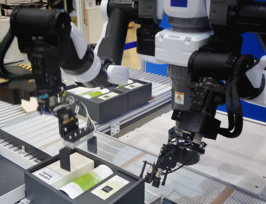 Close-up of an industrial robot working on an assembly line. 