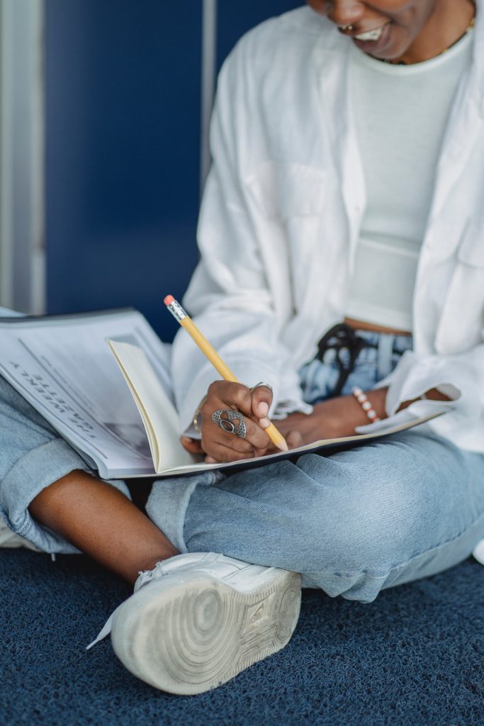 A woman works on her academic scholarship submission.
